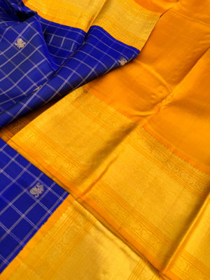 Colours of Navarathri 2025 on Kanchivaram - most grandest and most solid deep blue and golden mustard Korvai Kanchivaram with full gold zari woven broad borders with mayil chackaram woven buttas