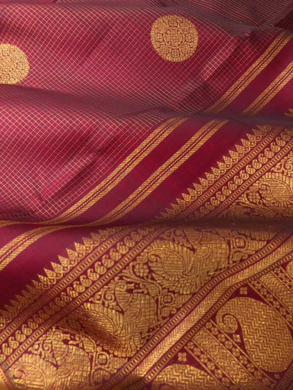 Kamakshi - One of  a Kind Kanchivaram - the grand of grandest aaraku maroon Vairaoosi kattam with chackaram woven buttas on 5 row woven aarai maadam borders