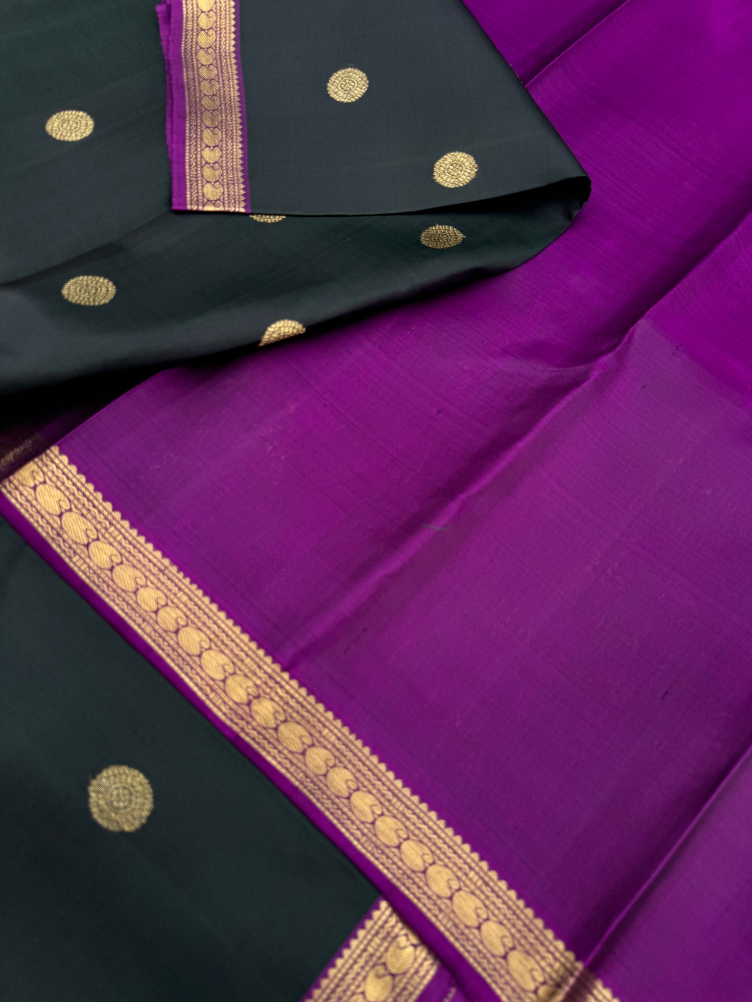 Leela - The bliss of small border Kanchivarams - dark deep intense karum pachai with majentha pallu and blouse