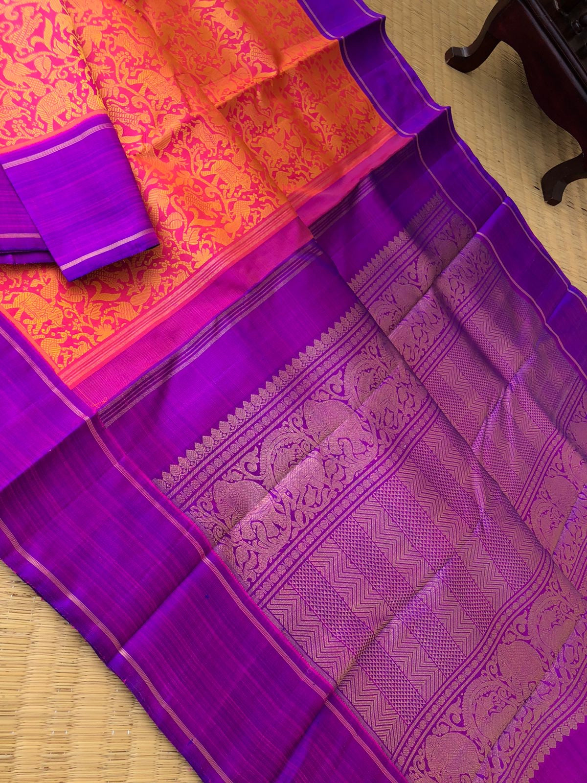 Yarn play on Kanchivaram - floral pink and mustard body vanasingaram with short violet borders pallu
