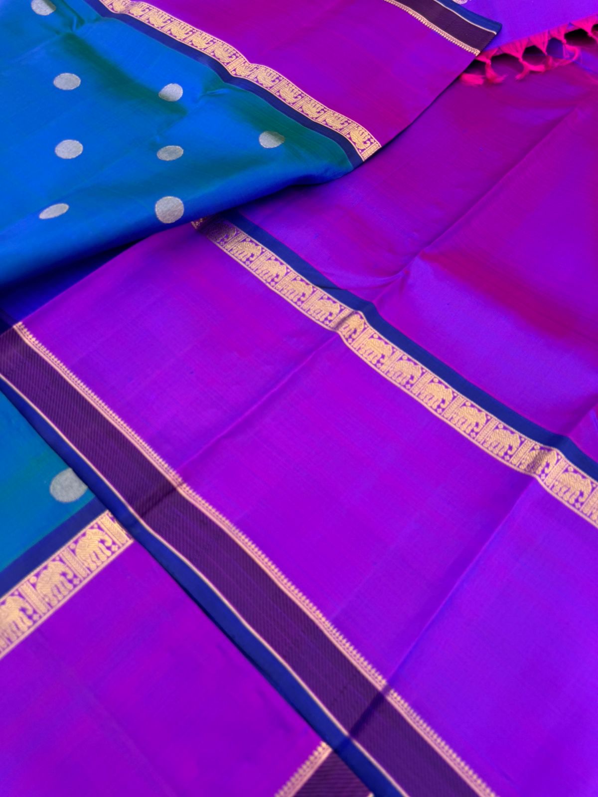 Colour Play on Kanchivaram - stunning peacock blue green dual tone body with violet tone broad woven borders