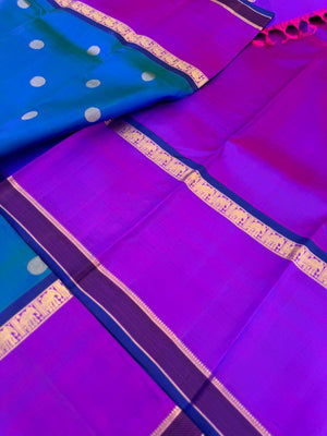Colour Play on Kanchivaram - stunning peacock blue green dual tone body with violet tone broad woven borders