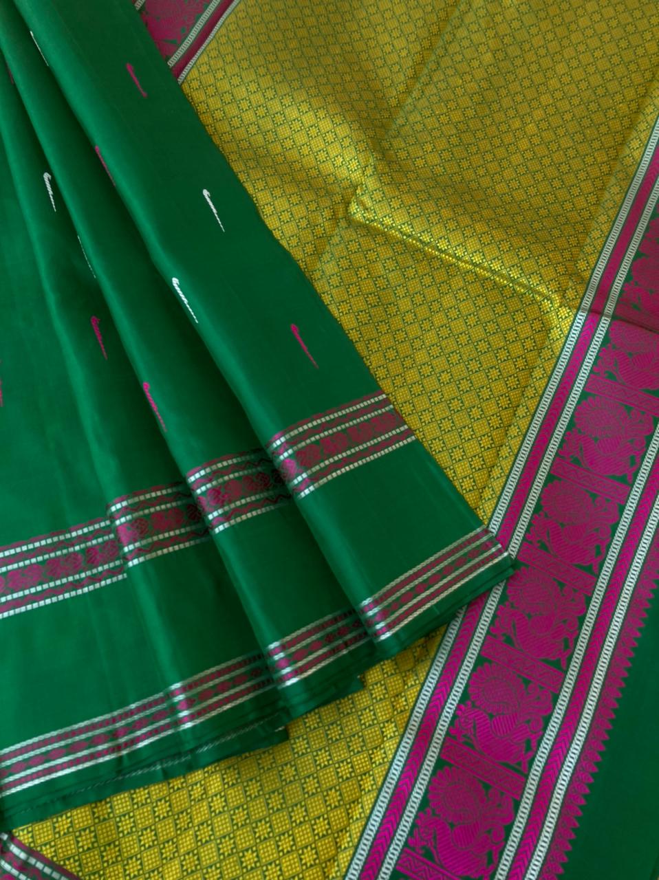 Woven from Memories - Beautiful No Zari Kanchivarams - stunning dark green with traditional retta pett woven borders and malli mokku woven buttas