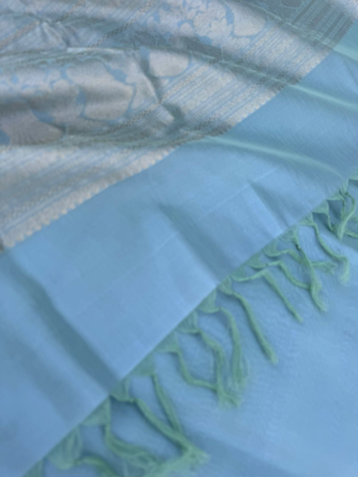 Pastels on Zari Kissed Silk Cotton - a pastel ice blue with one inch tissue borders and grand pallu ( u need to view this saree in natural light )