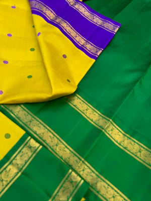 Vintage Ragas on Kanchivaram - a much loved sampanga yellow korvai Kanchivaram with retta pett ganga jammuna korvai borders with silk buttas woven body