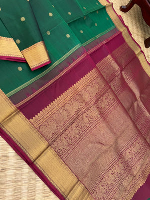 Colour Play on Kanchivaram - the beautiful deep dark meenakshi green with aaraku pallu and blouse with solid gold zari woven borders