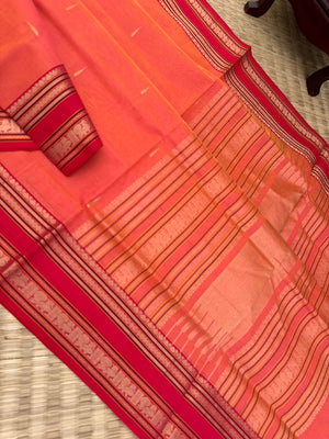Zari Kissed Silk Cotton - a peach kanakambaram rain drop woven buttas