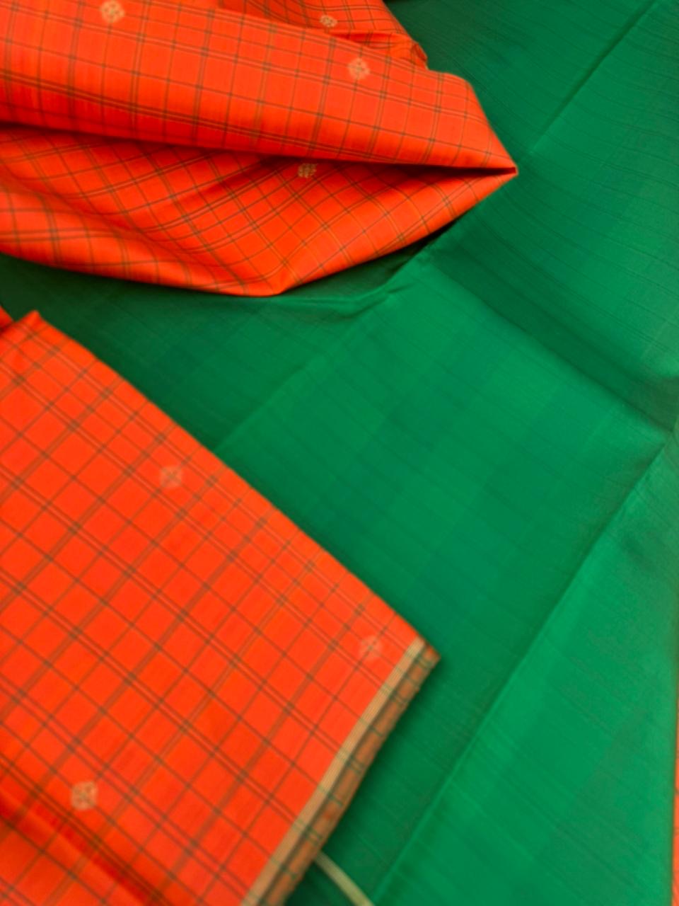 Kanchivaram Trunk - a simple elegant kattam buttas with borderless concept !! In orange and green combination