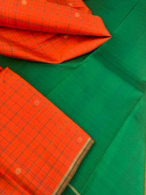 Kanchivaram Trunk - a simple elegant kattam buttas with borderless concept !! In orange and green combination
