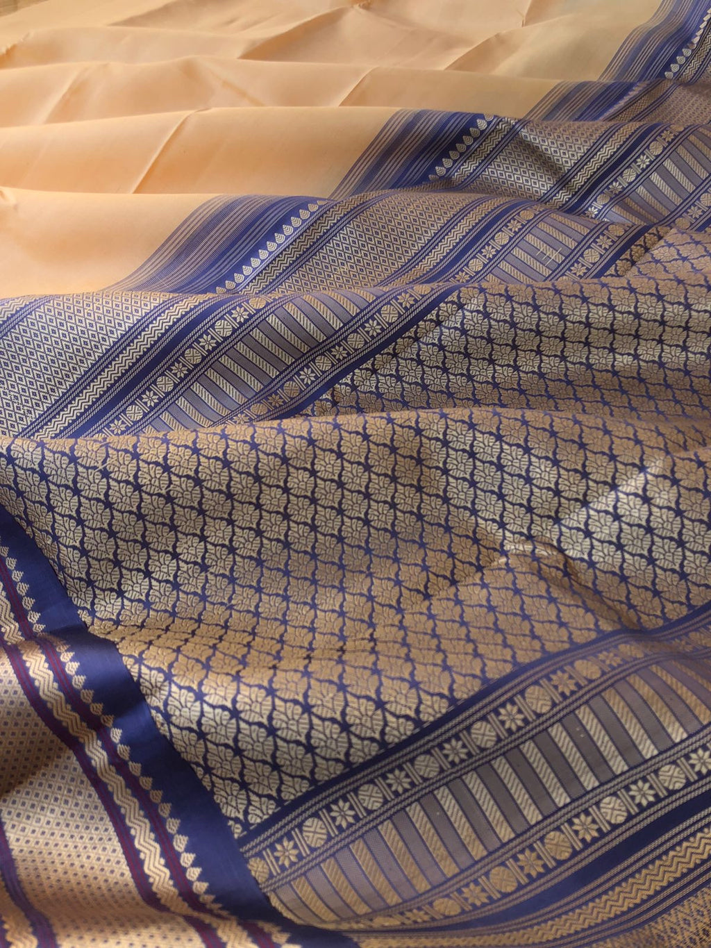 Sahasra - perfect sandal off white with bluish grey no zari korvai Kanchivaram with mayil kann motifs woven borders