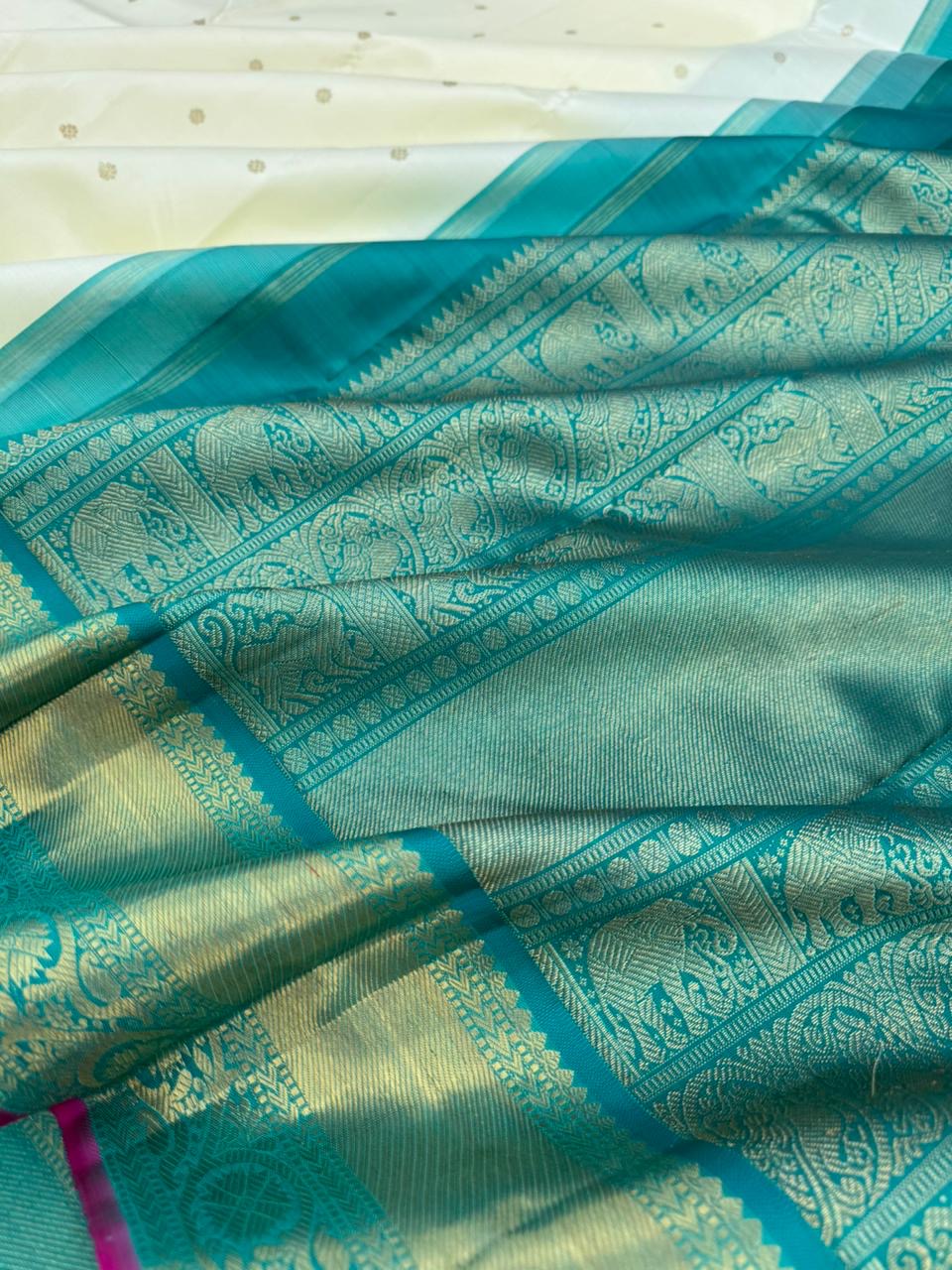 Colours of Navarathri 2025 on Kanchivarams - gorgeous gorgeous white and teal Korvai Kanchivaram is absolutely a treasure for the life time
