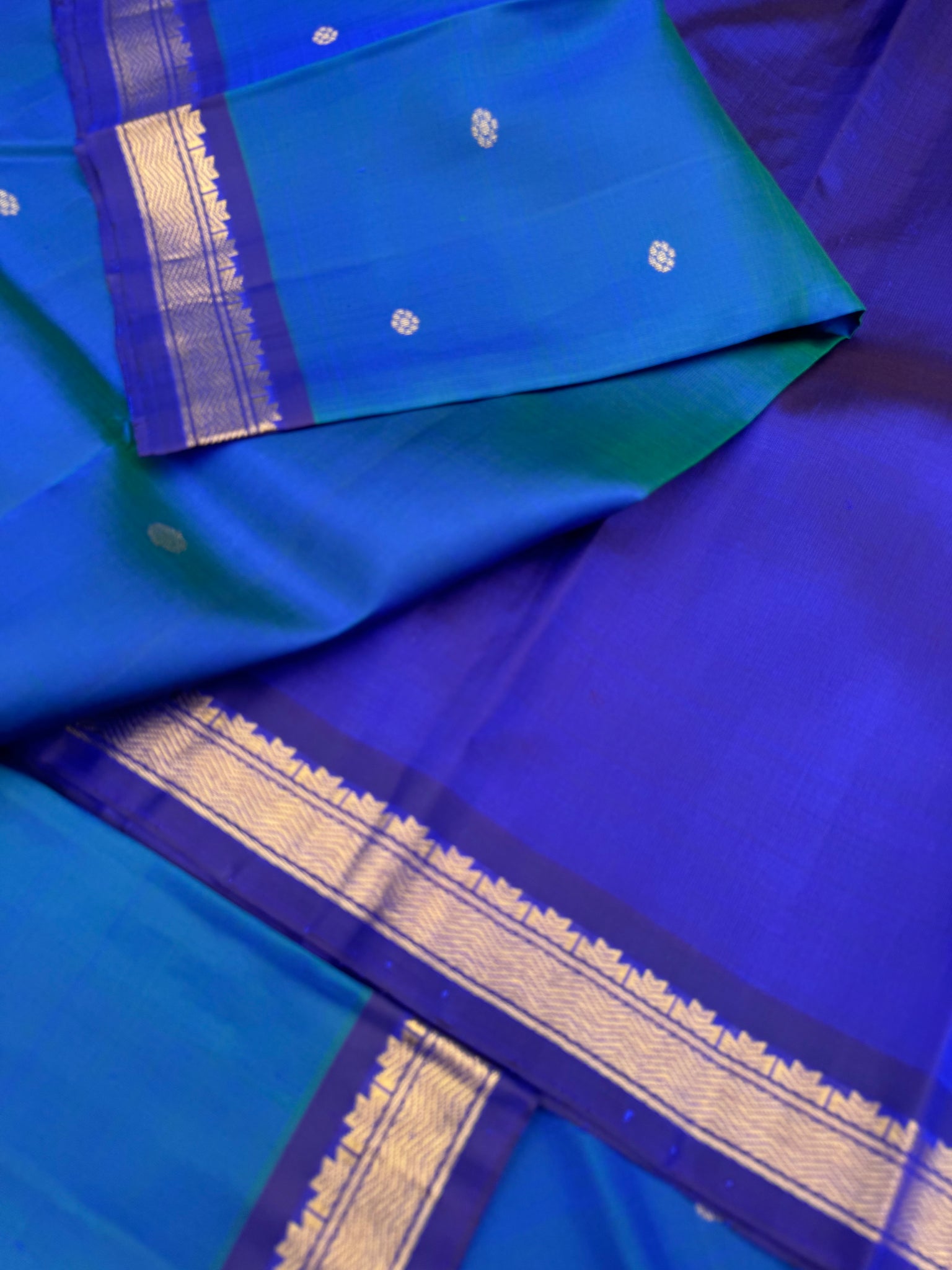 Leela - a mostly beautiful peacock blue green dual tone body with deep dark ink blue pallu and blouse