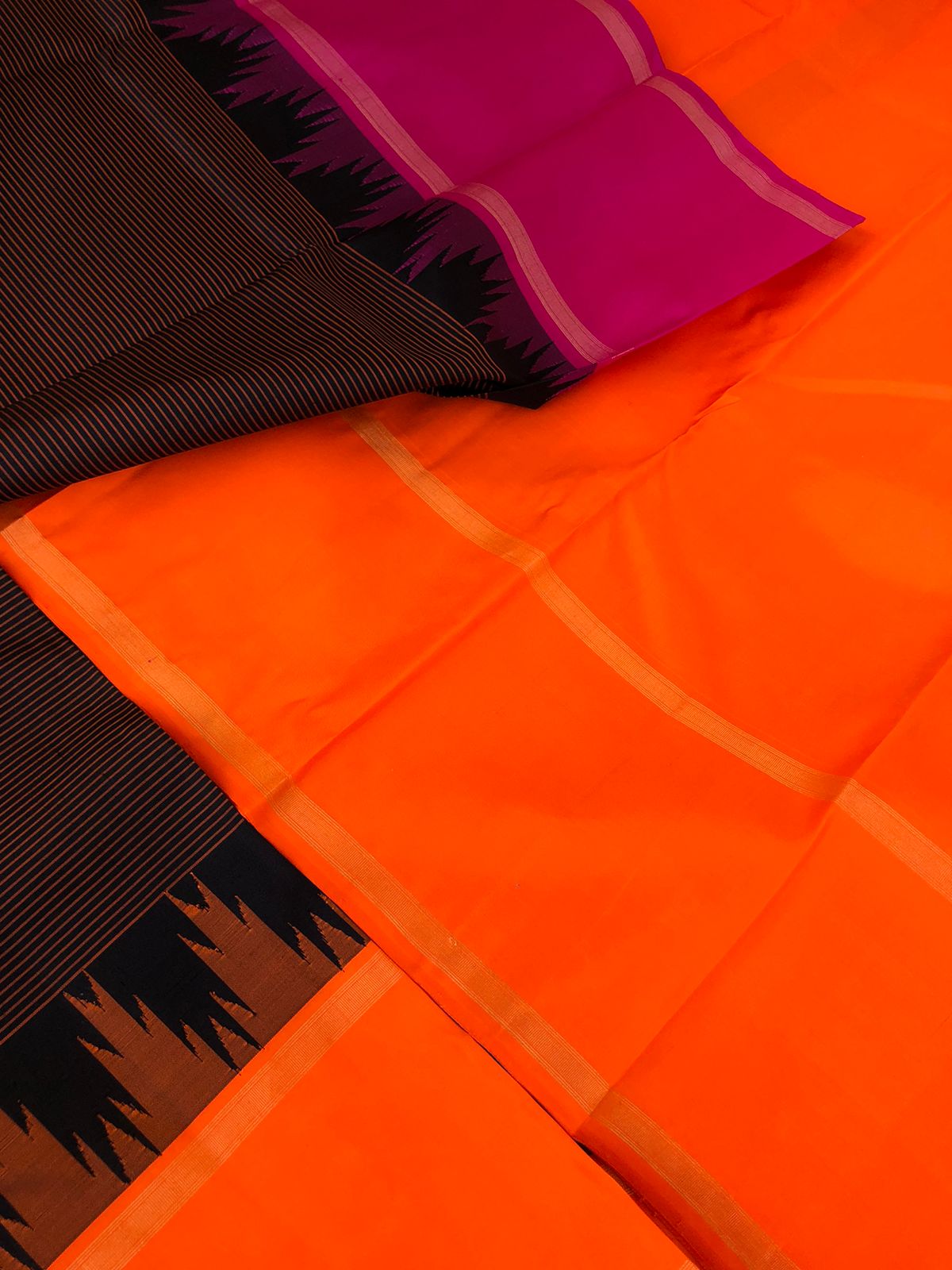 Connected by Korvai on Kanchivaram - a beautiful black stripes body with orange and pink ganga jammuna woven borders