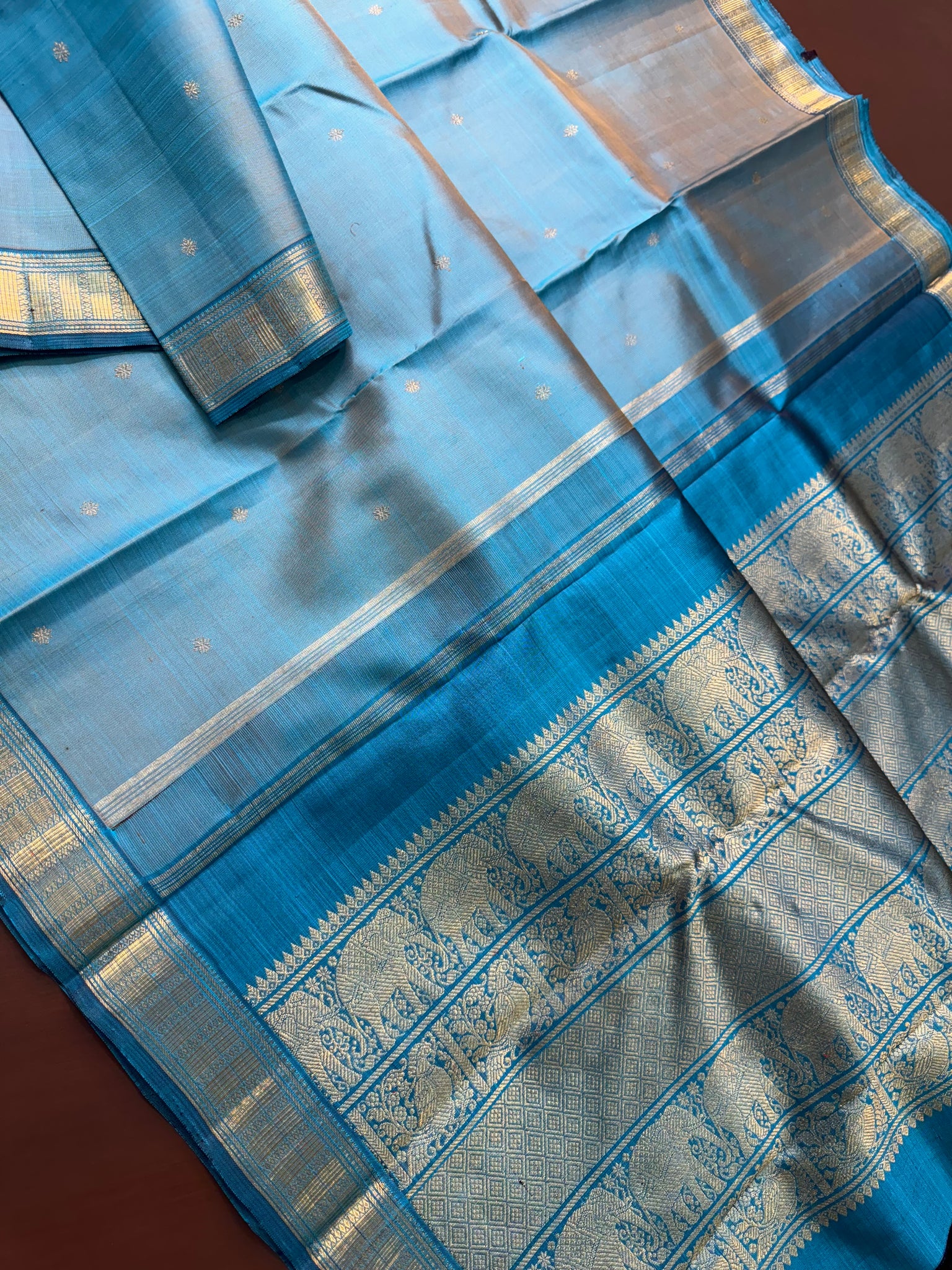 Leela - The bliss of small border Kanchivarams - a dual tone English powder blue at the best