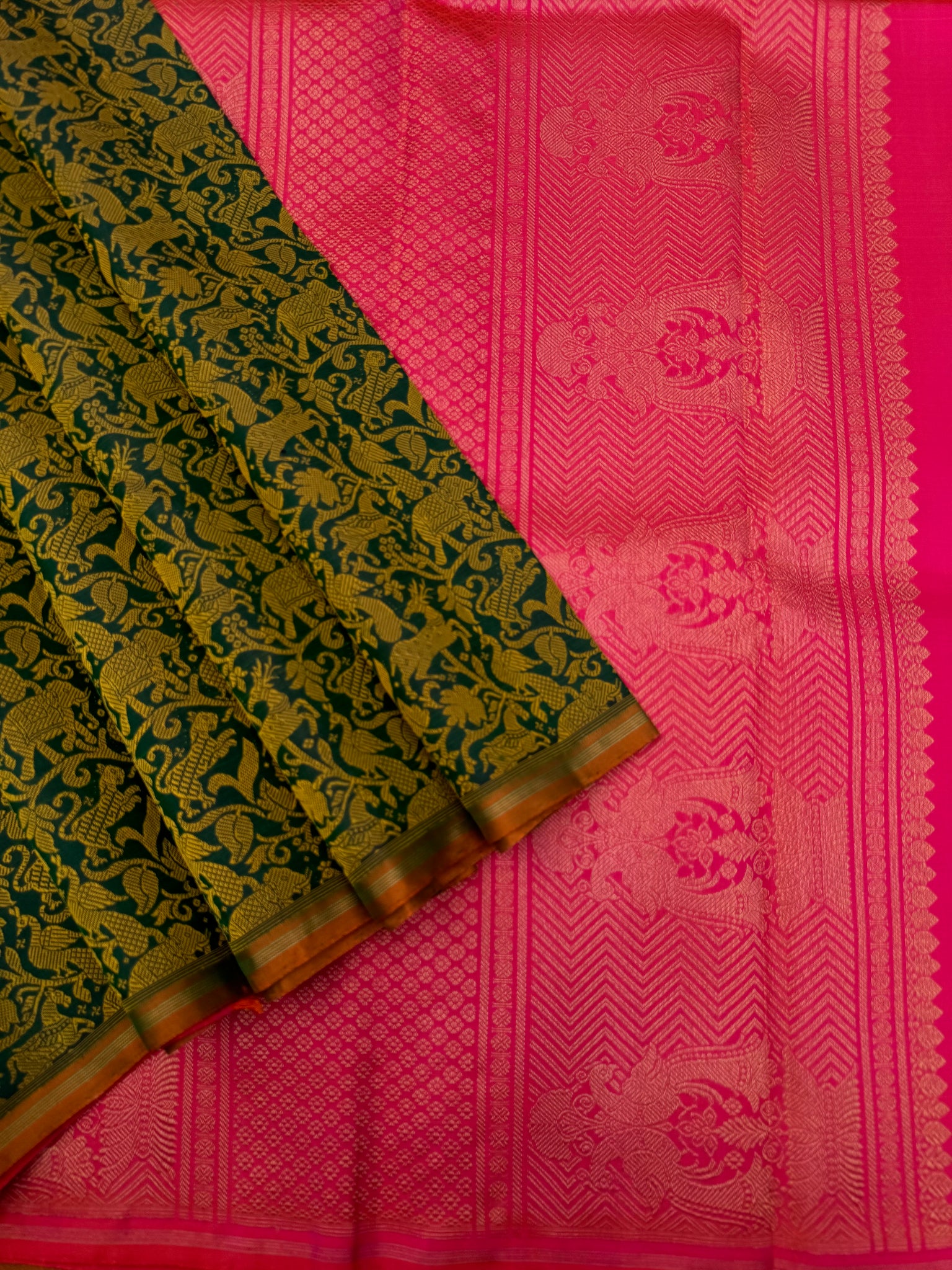 Haritham - Heirloom Yarn Play on Kanchivaram - a stunning deep green base and mustard silk weave vanasingaram with orangish pink dual tone pallu ans blouse