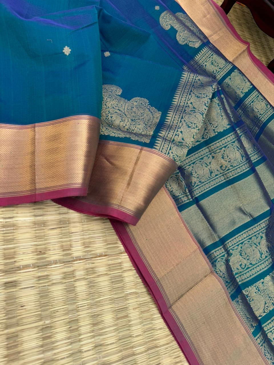 Zari Kissed Silk Cotton - a dual tone peacock blue with solid gold zari woven borders with corner paisley buttas