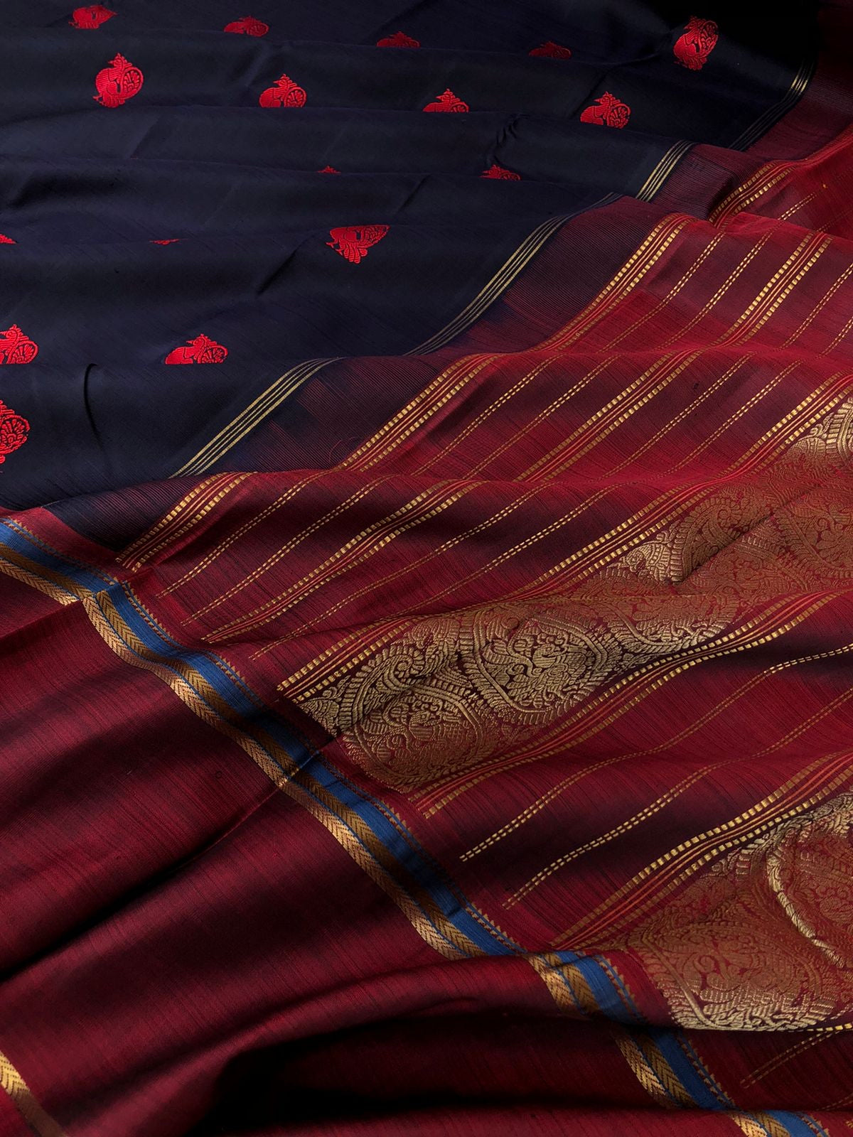 Kaavyam on Kanchivaram - the one of a kind deep mid night black blue body with annapakshi woven buttas with deep maroon borders pallu and blouse