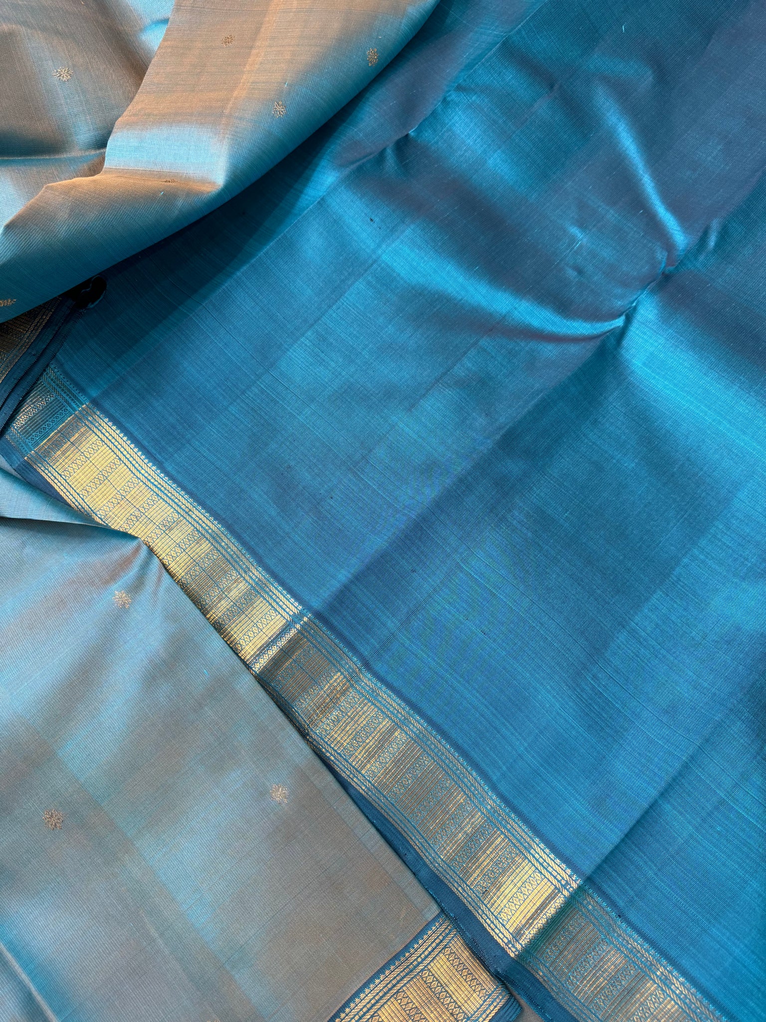 Leela - The bliss of small border Kanchivarams - a dual tone English powder blue at the best
