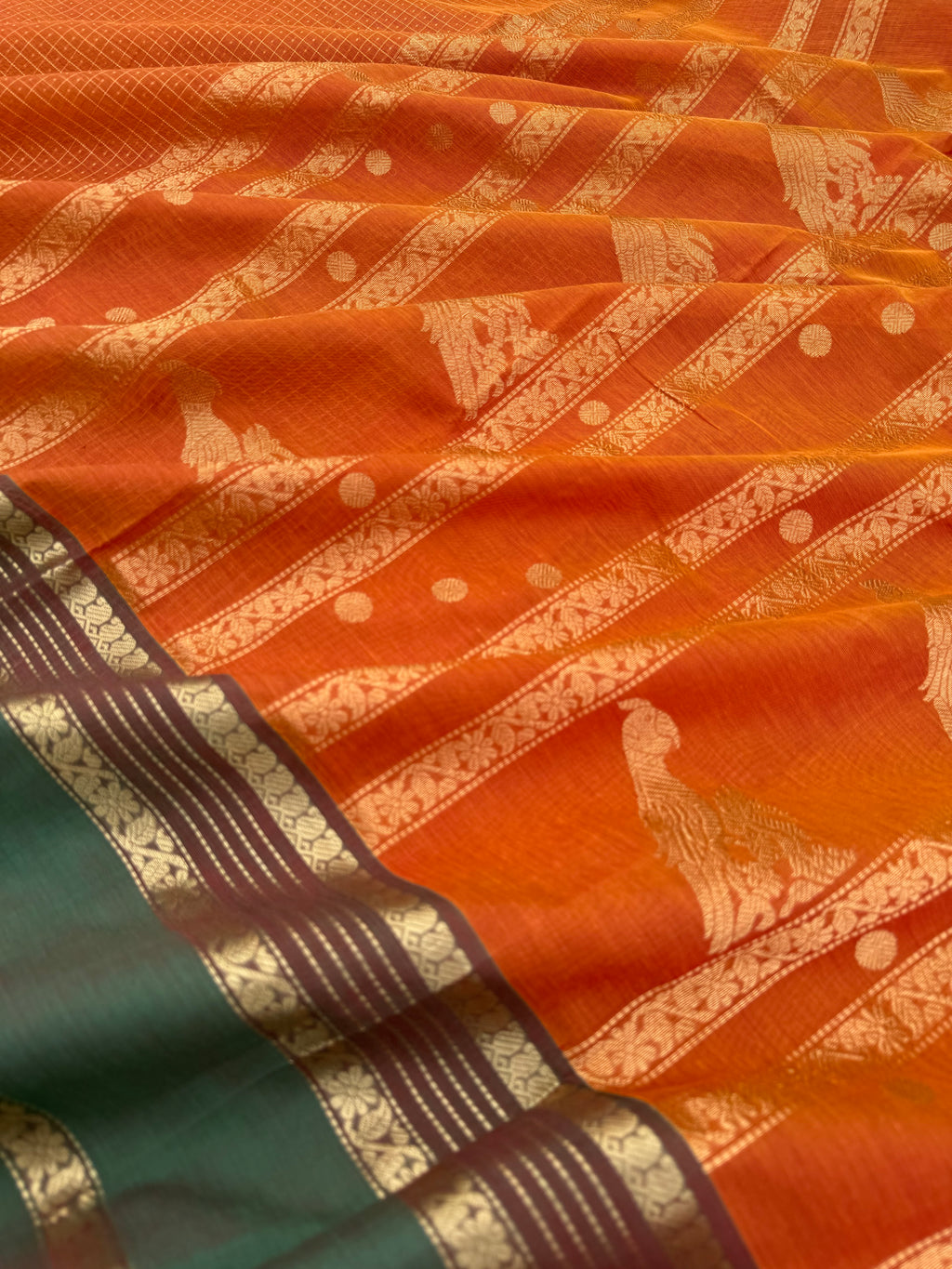 Zari Kissed Silk Cotton - rust orange and short green lakshadeepam with grand long killi woven pallu