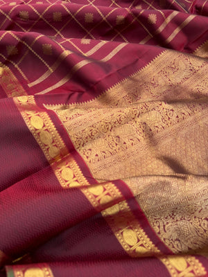 Annapoorani - the gorgeous deep maroon and gold with veldhari kolam buttas woven body with retta pett woven borders