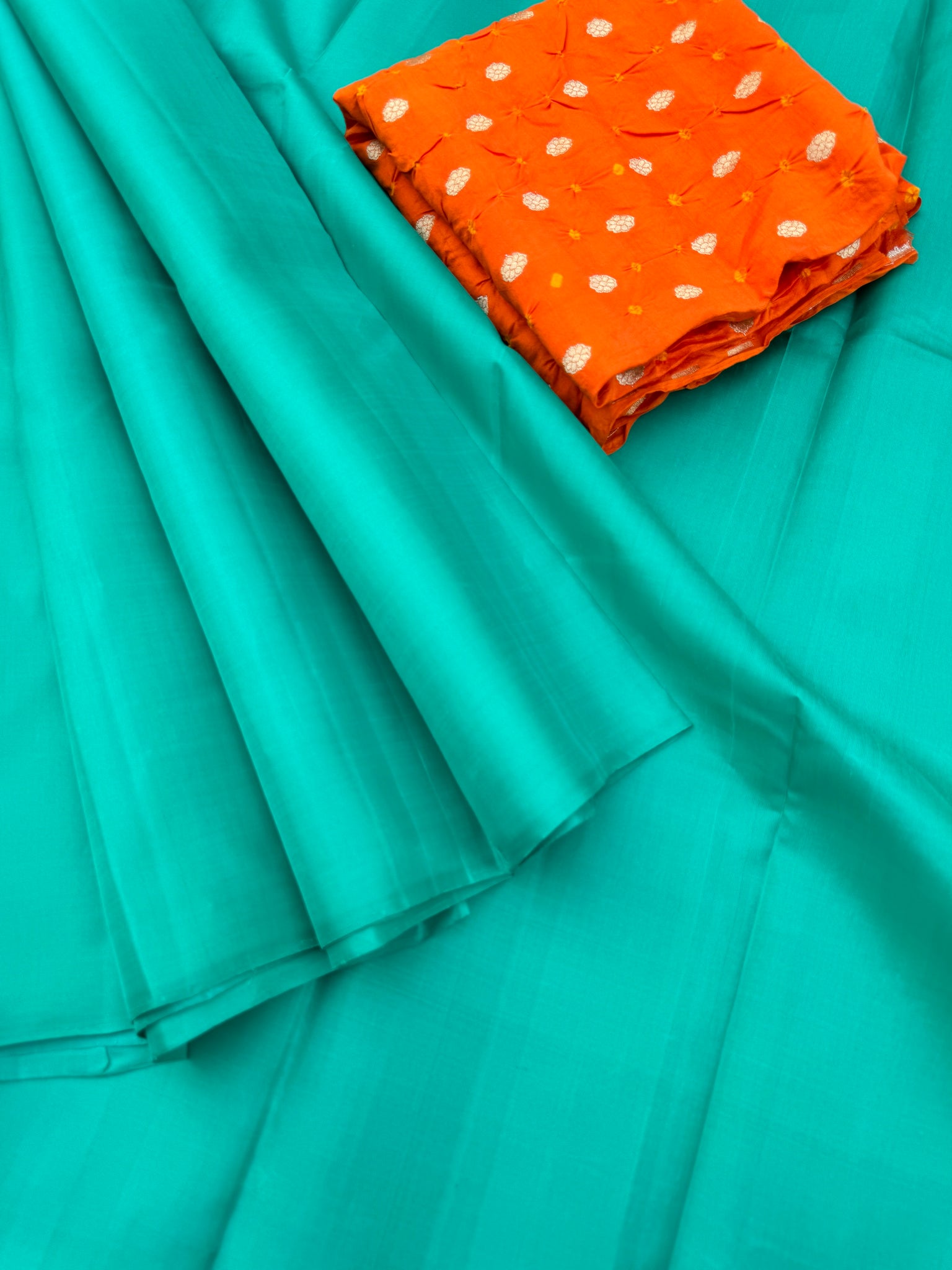 Niram - Celebrating of Full Plain Kanchivaram Silks Paired with Beautiful Blouses - a gorgeous aqua teal saree with orange bandhani silk blouse