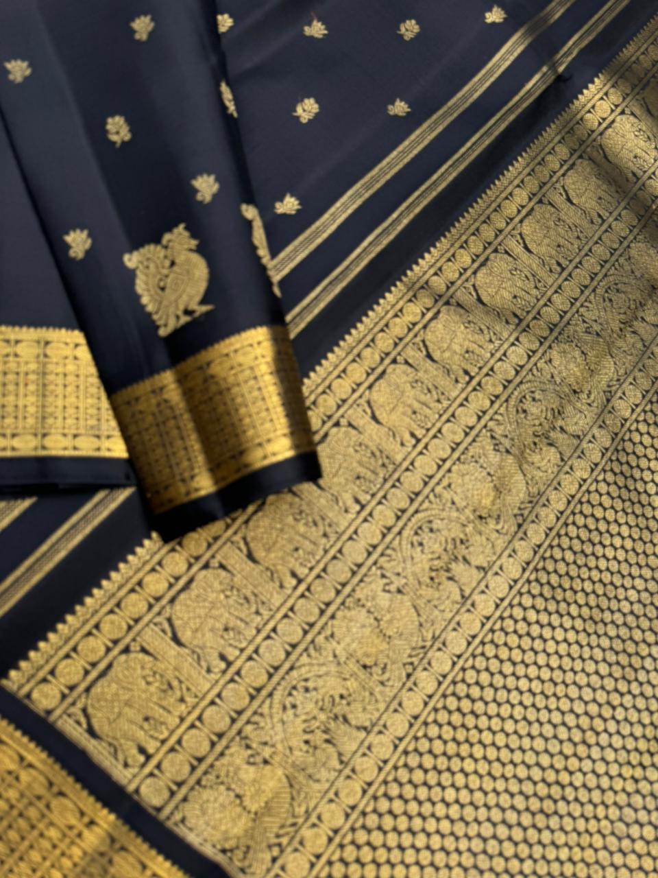 Vintage Ragas on Kanchivaram - a rarest gem of this collection, a full black and gold with old charm bettu buttas woven borders
