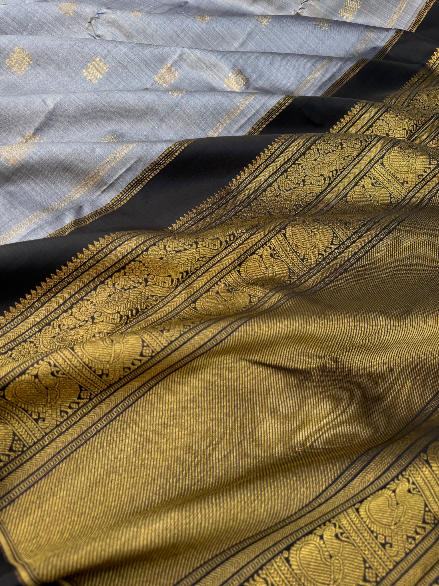 Mohaa - Beautiful Borderless Kanchivarams - stunning metallic grey and black with kolam buttas with grand woven pallu