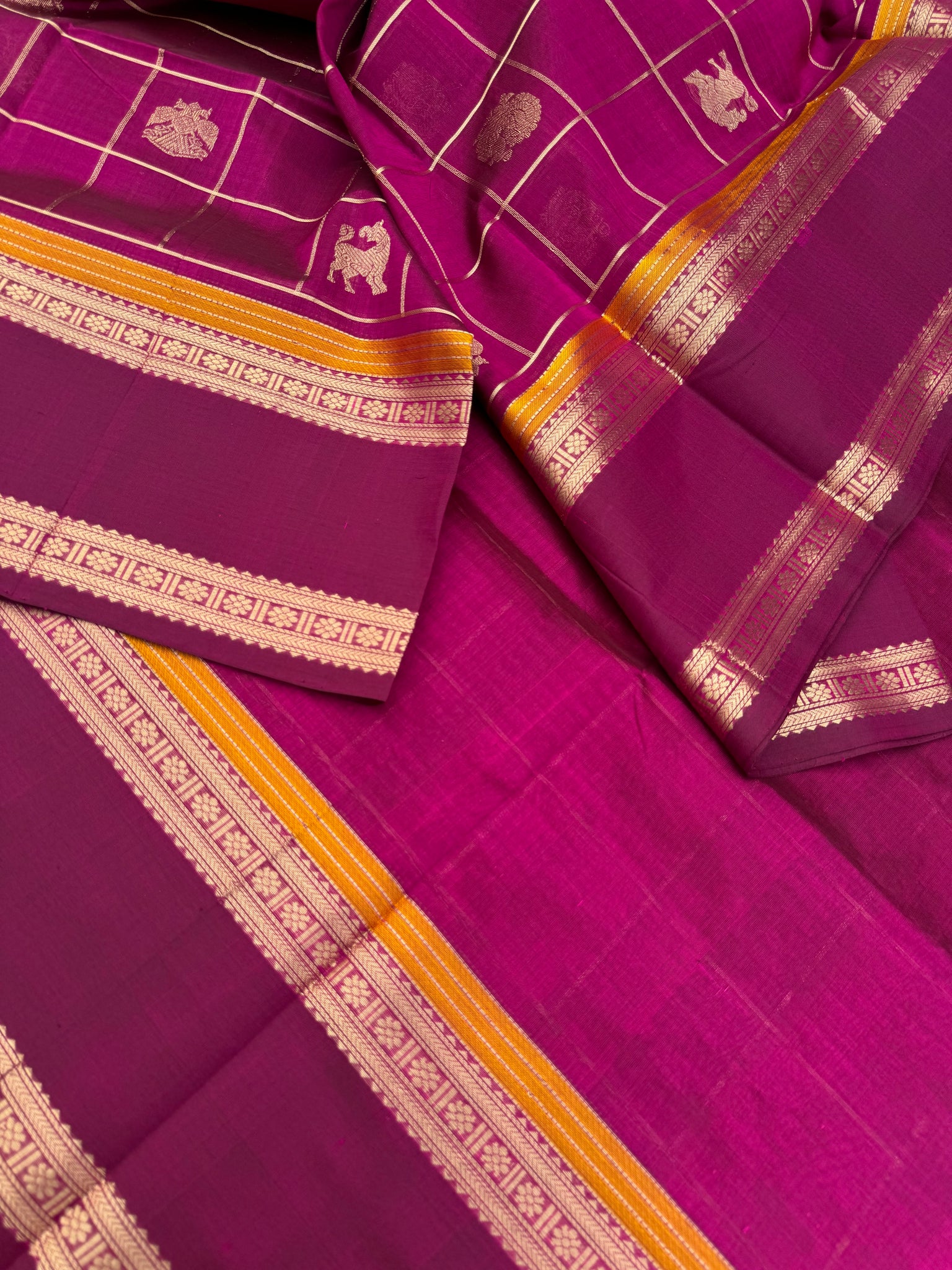 Zari Kissed Silk Cotton - a gorgeous majentha with annam yali and irruthalai pakshi woven buttas