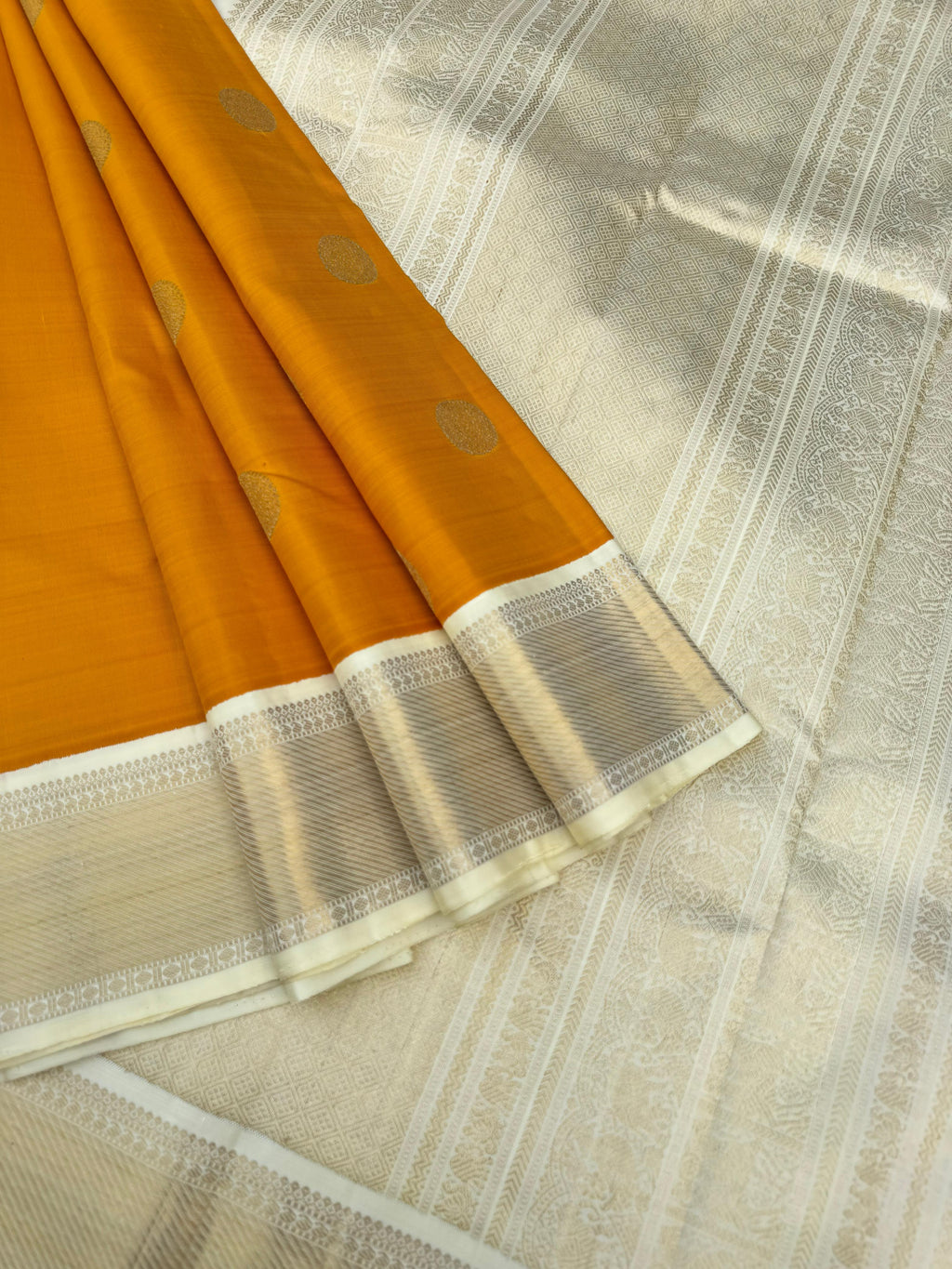 Nila - The gorgeous off white/cream/venn pattu korvai border Kanchivarams - stunning trendy combination of mustard and gold off white