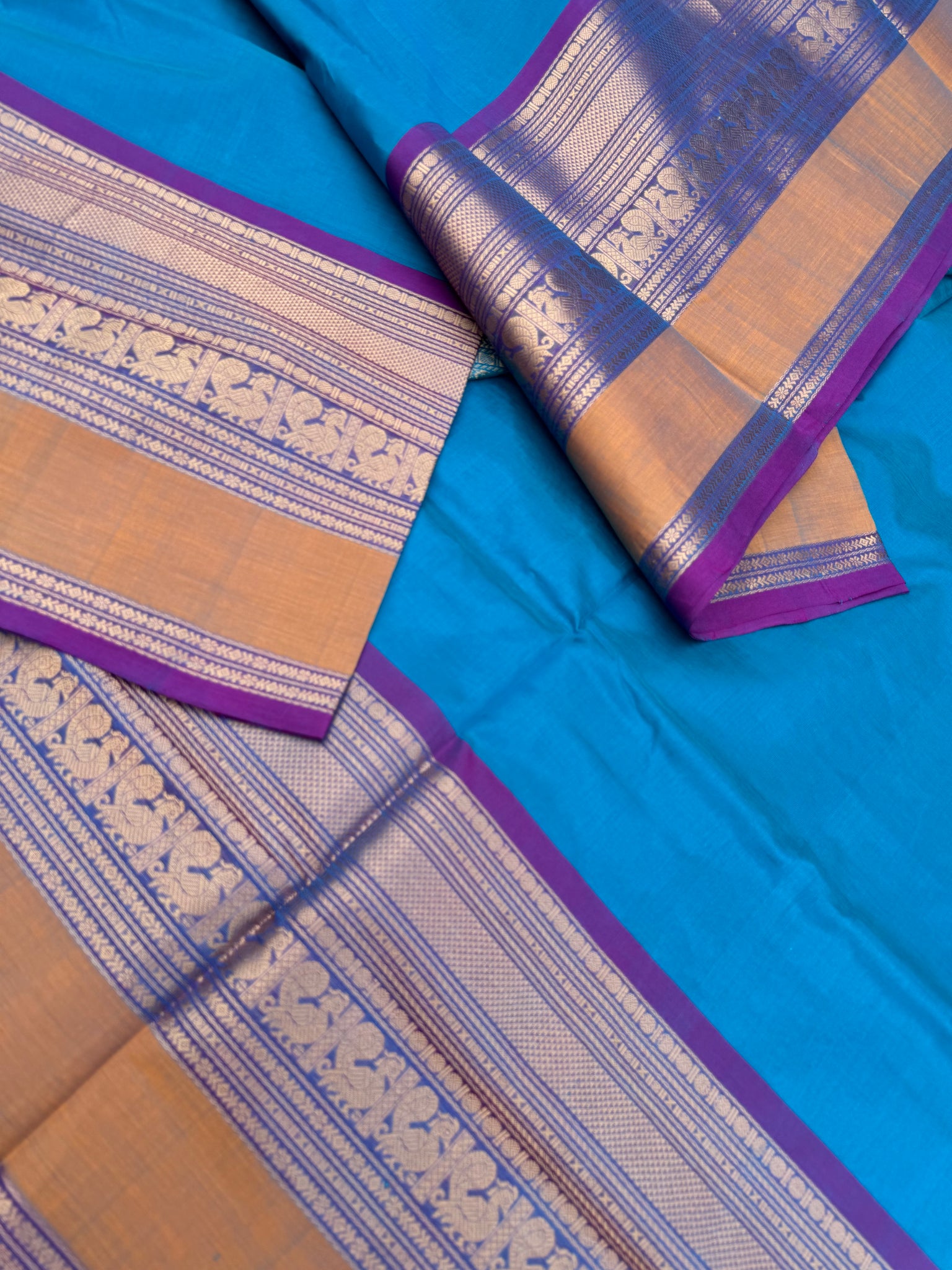 Zari Kissed Silk Cotton - a stunning sulphate anandha blue with grandest borders and pallu