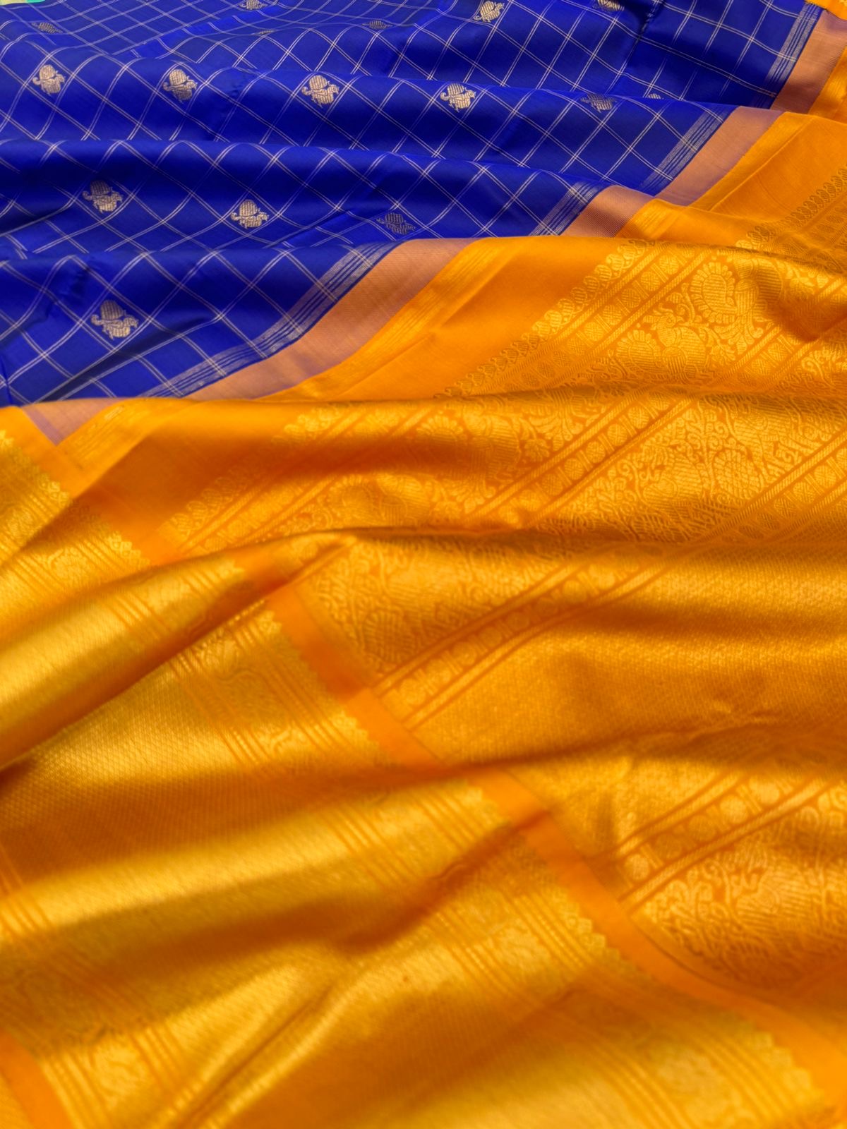 Colours of Navarathri 2025 on Kanchivaram - most grandest and most solid deep blue and golden mustard Korvai Kanchivaram with full gold zari woven broad borders with mayil chackaram woven buttas