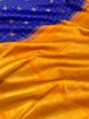 Colours of Navarathri 2025 on Kanchivaram - most grandest and most solid deep blue and golden mustard Korvai Kanchivaram with full gold zari woven broad borders with mayil chackaram woven buttas