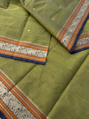 Mangalavastaram - a stunning deep algae green with elephant woven borders