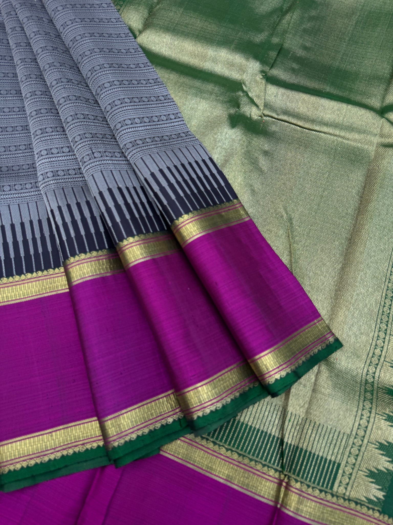 Haritham - Heirloom Yarn Play on Kanchivaram - a grey black full body varusai pett with green pallu and blouse with majentha borders