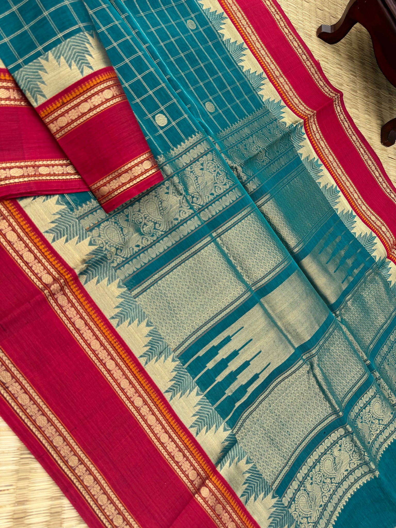 Zari Kissed Silk Cotton - a burnt oil blue and brick red with all traditional elements in one saree