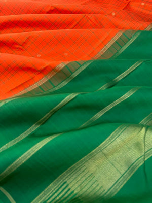 Kanchivaram Trunk - a simple elegant kattam buttas with borderless concept !! In orange and green combination