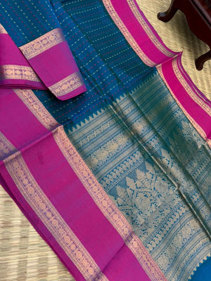 Woven Motifs Silk Cotton - a dark peacock blue lakshadeepam with retta pett woven borders
