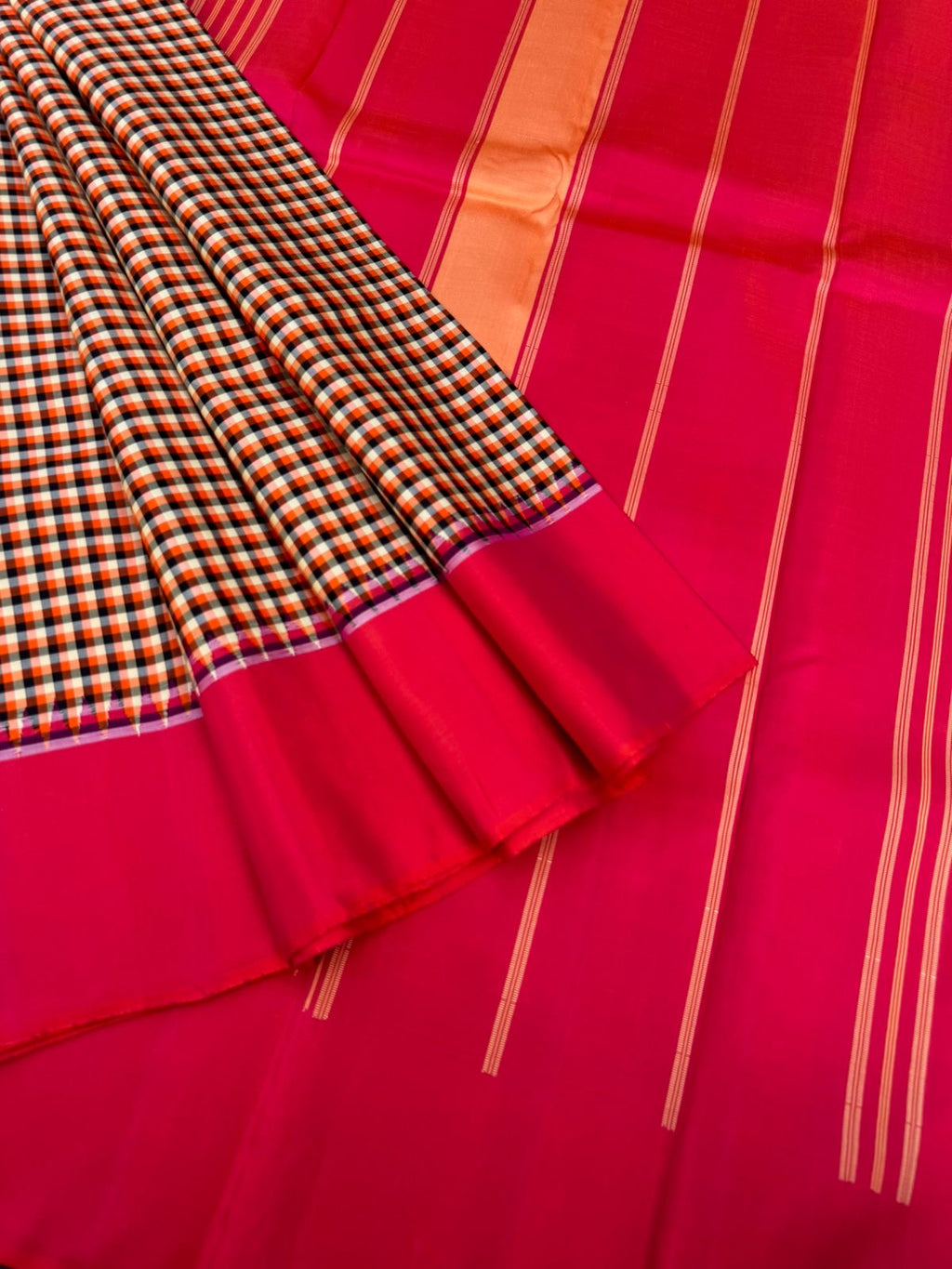 Rarest Korvai Kanchivaram - the body has tiny off white, orange, black chex with orange mixed pink Korvai woven borders