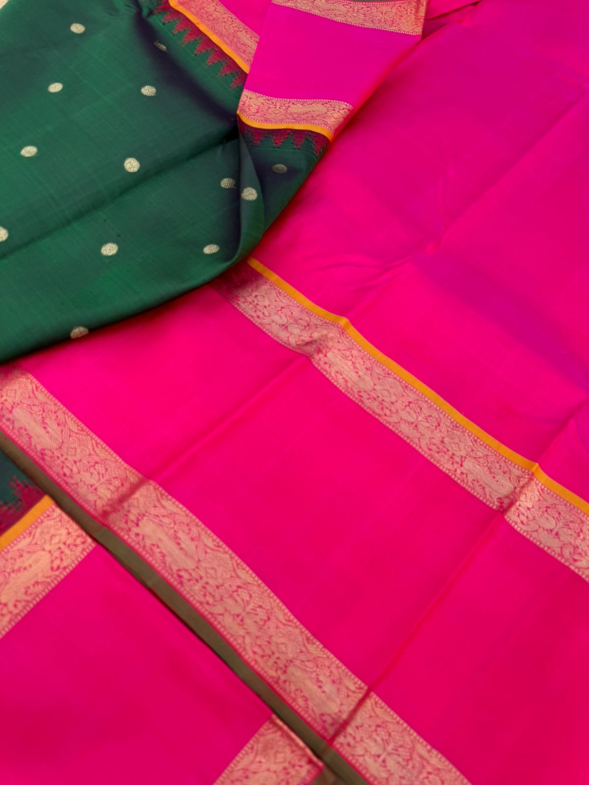 Colour Play on Kanchivaram - deep dark green and pink with broad korvai woven borders