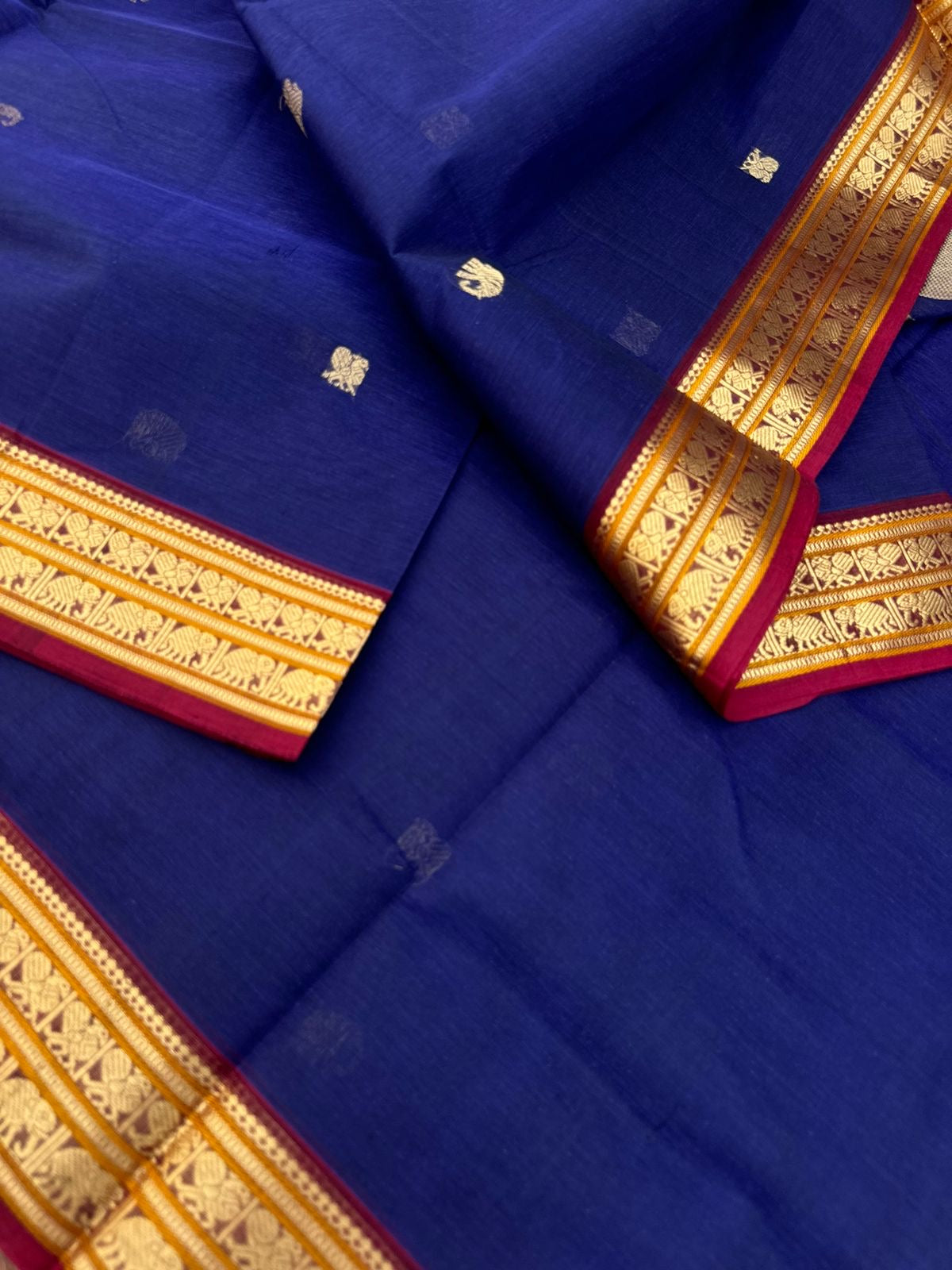 Dark Edition on Zari Kissed Silk Cotton - dark deep blue with one row of parrot woven buttas in the junction of pallu and blouse
