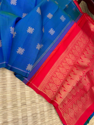 Colour Play on Kanchivaram - peacock blue green kolam buttas woven body with red tone woven pallu and blouse