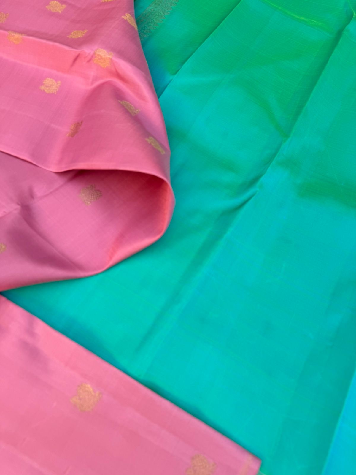 Uniquely Woven Kanchivarams - baby pink Mayil chackaram woven body with rain pink and aqua two colour woven long pallu
