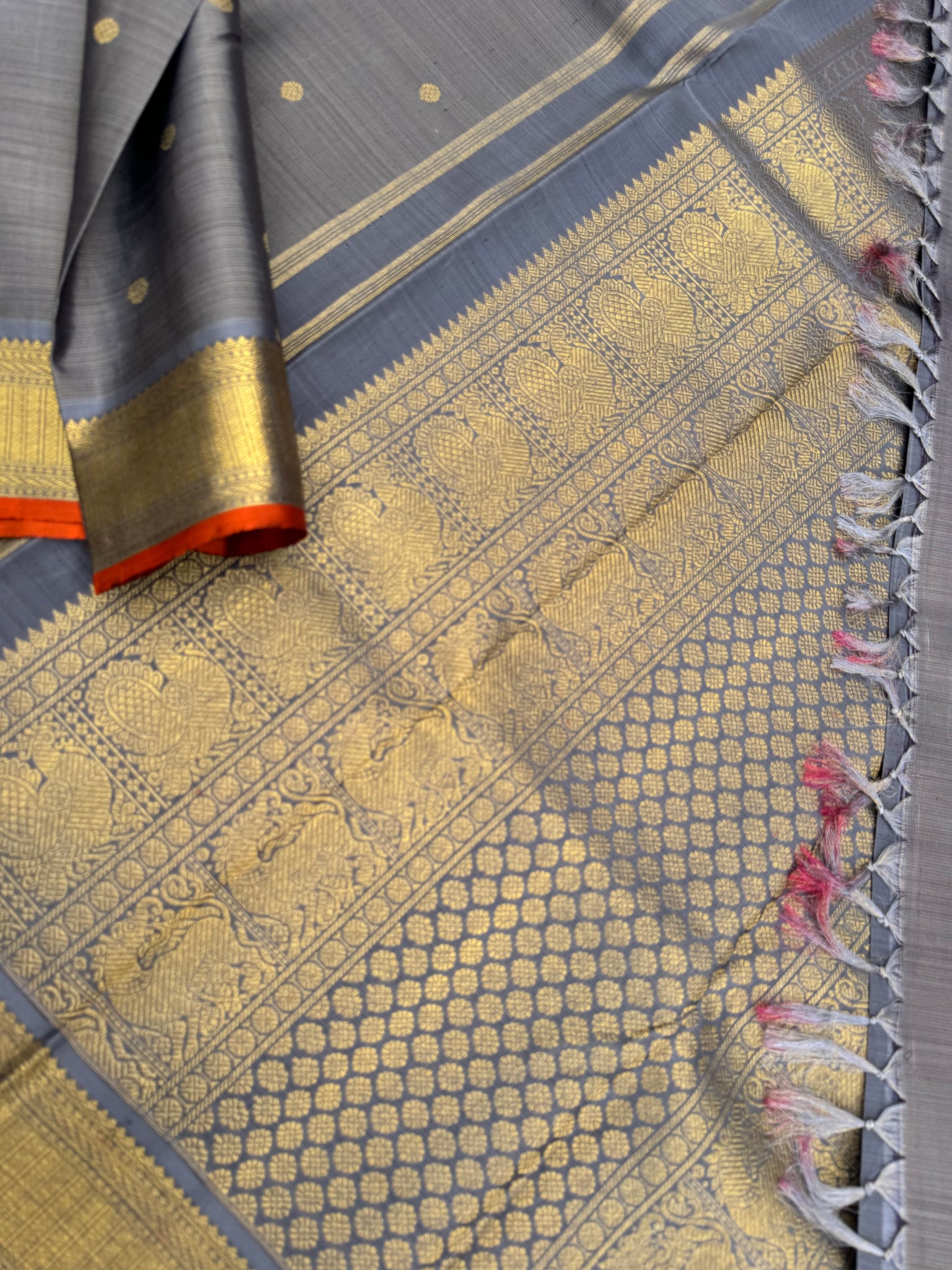 Molten Play on Kanchivaram - a stunning unusual molten Metallic grey vairaoosi the best part of the saree is the burnt orange sleeve edge