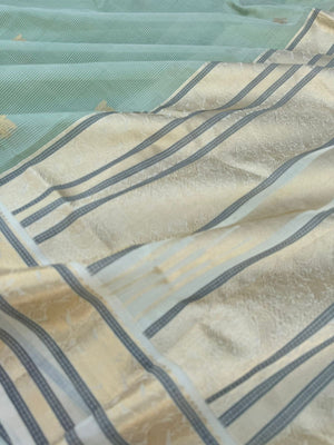 Pastels on Zari Kissed Silk Cotton - pastel pista green best part is the body has a invisible strips will give a gorgeous look when draped