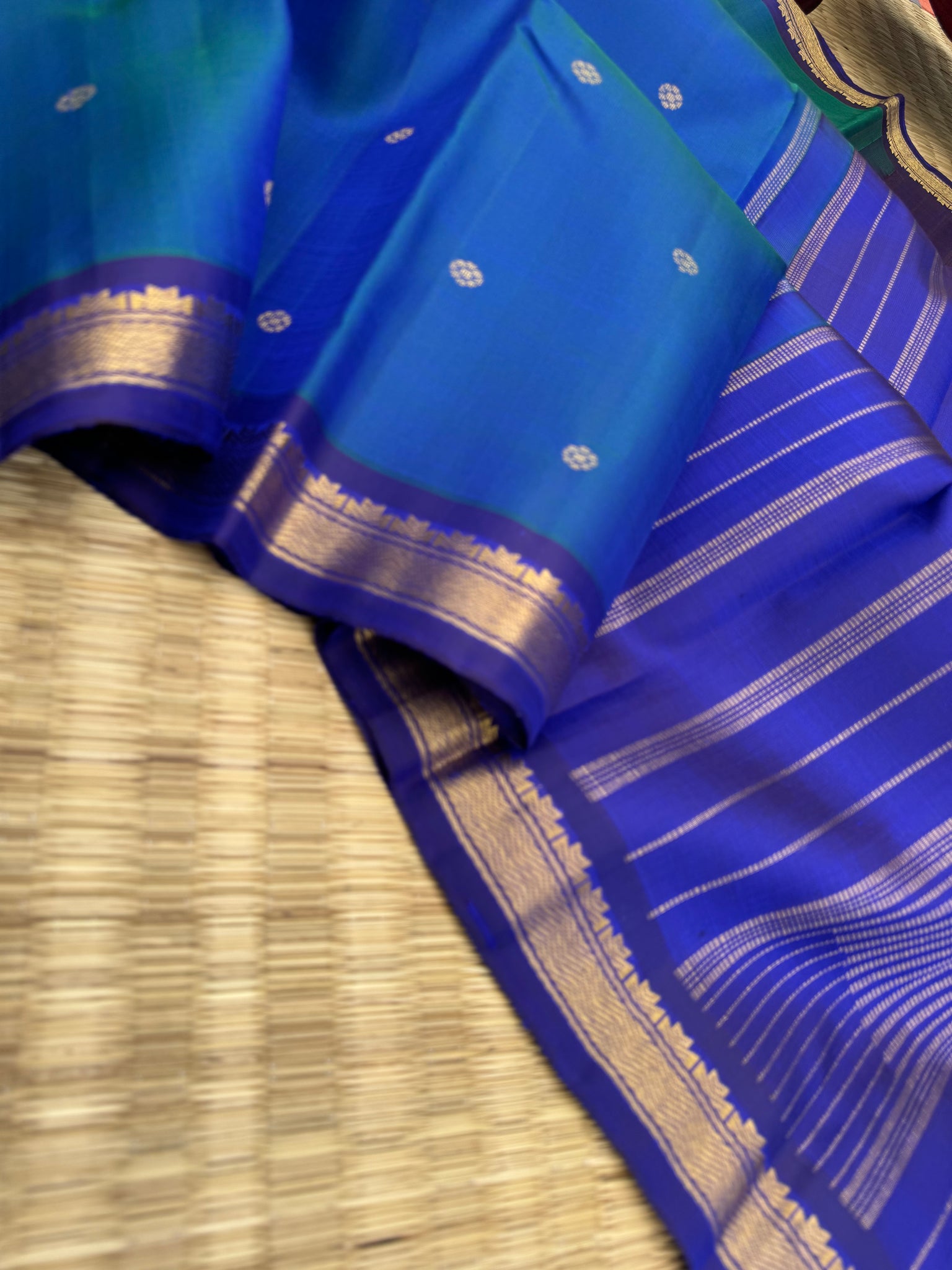 Leela - a mostly beautiful peacock blue green dual tone body with deep dark ink blue pallu and blouse