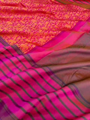 Vanasingaram on Kanchivaram - a pink base on motifs woven on mustard tone silk with varusai pett borders on no zari vanasingaram