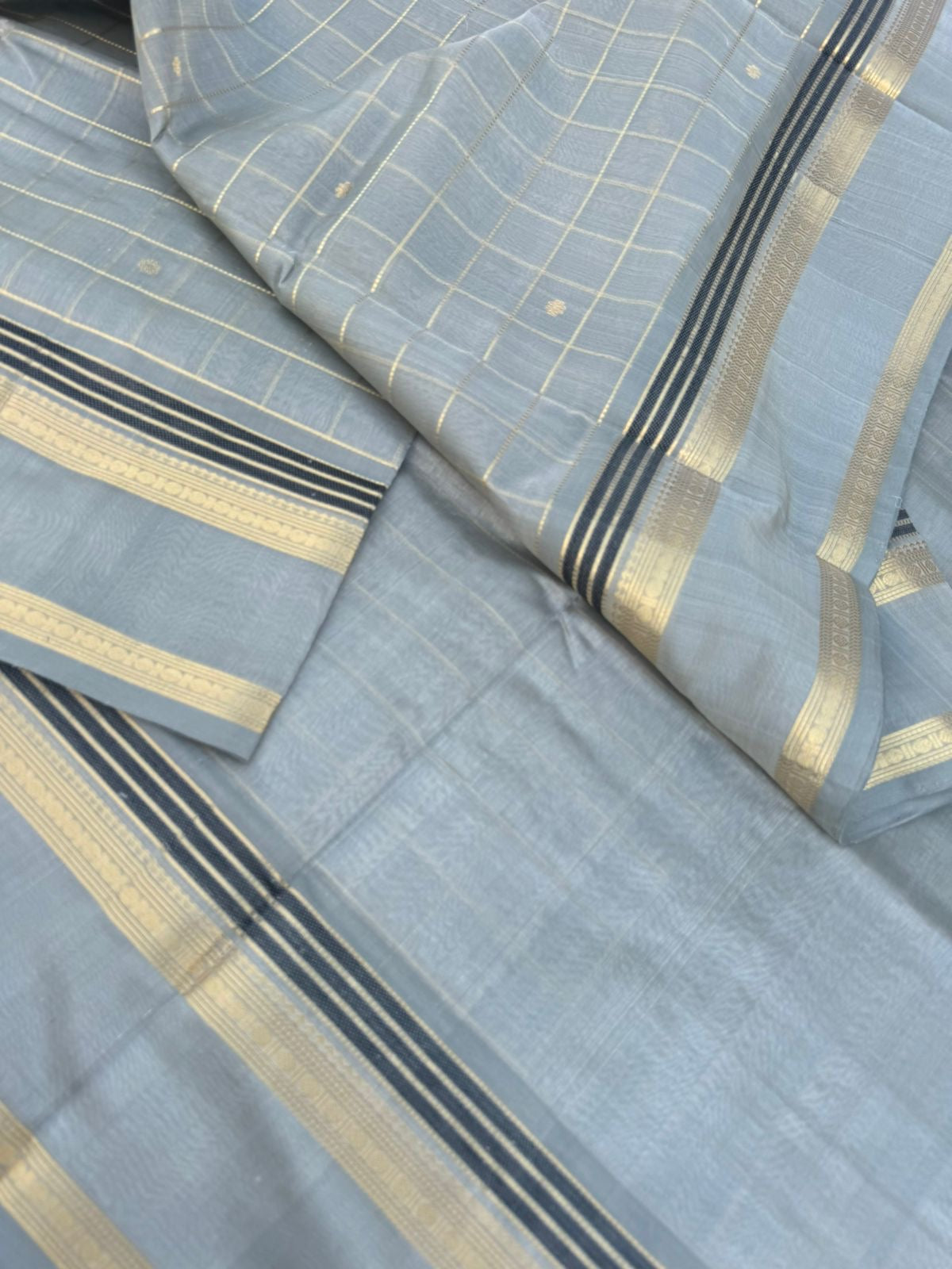 Pastels on Zari Kissed Silk Cotton - a stunning silver grey muthukattam with all traditional elements