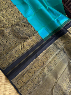 Tasteful Tall Border Kanchivarams - lovely dual tone blue and black with long zari woven one side korvai borders with grand pallu