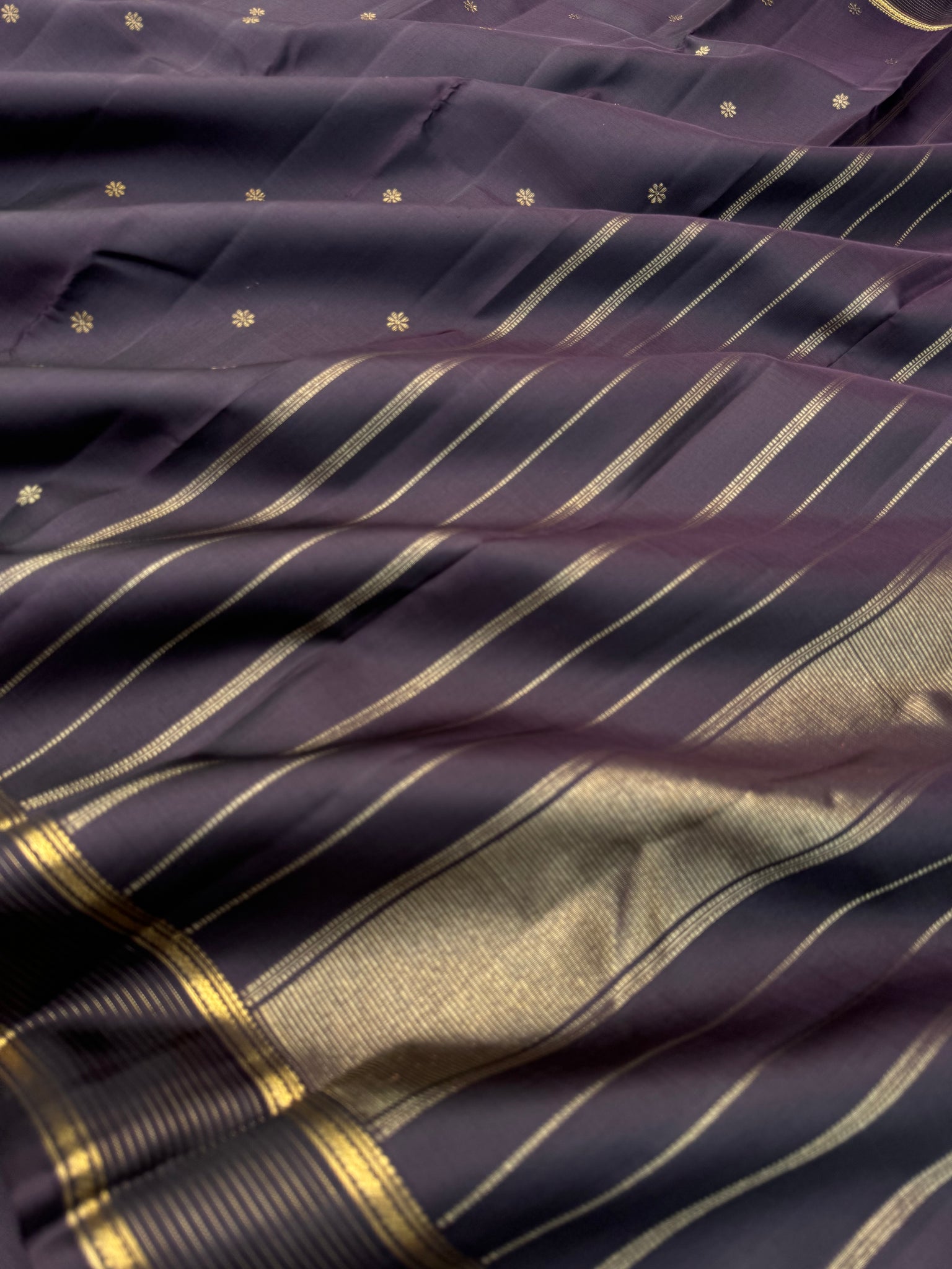 Aadthyayam – The Everyday Kanchivaram - a dark deep betel nut brown with vairaoosi boder with stunning buttas woven body