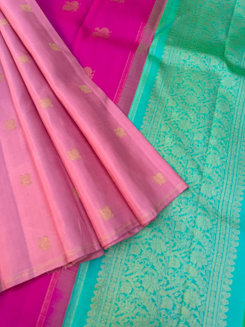 Uniquely Woven Kanchivarams - baby pink Mayil chackaram woven body with rain pink and aqua two colour woven long pallu
